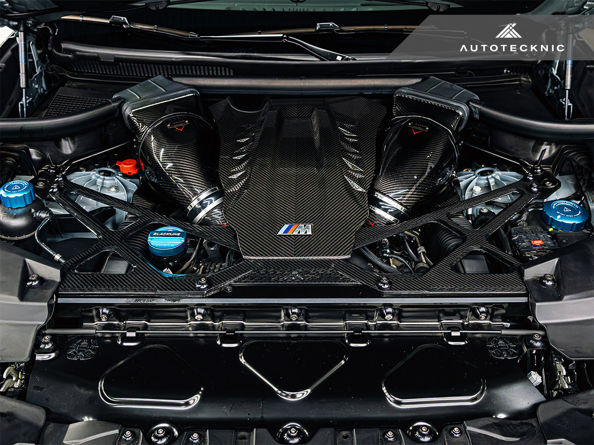 AutoTecknic Dry Carbon Strut Brace Installed in BMW X5M Engine Bay