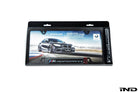 BMW M Performance Carbon Plate Frame angle view showing carbon fiber weave pattern